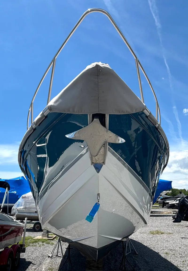 Slide: The Image of 2006 Formula 400 Super Sport with a shiny hull, on a dry dock under a blue sky. - 3