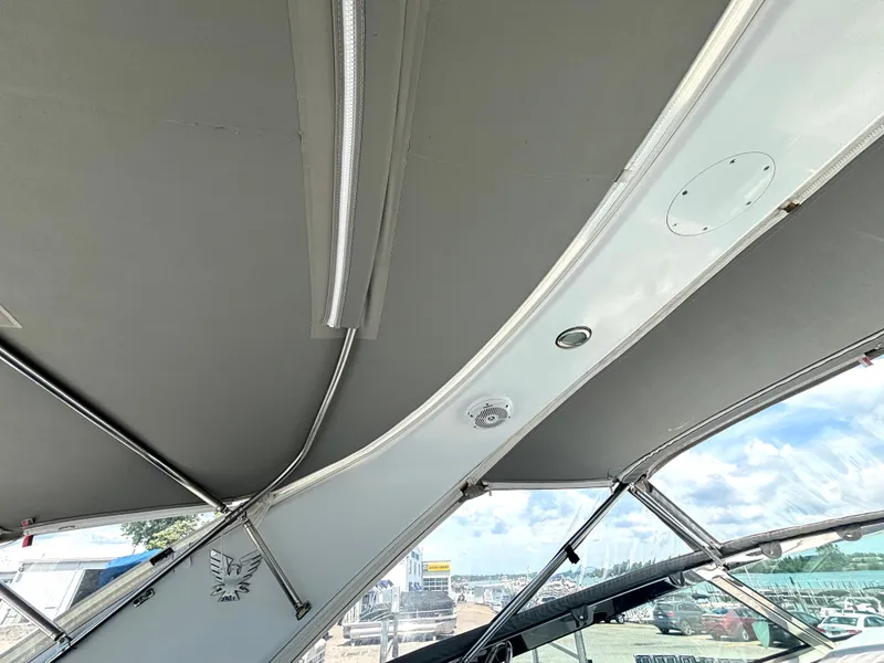 Slide: The Image of The image shows the cockpit roof of a 2006 Formula 400 Super Sport with a gray canopy. - 33