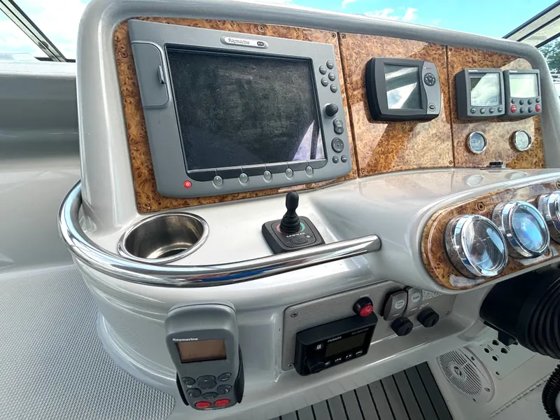 Slide: The Image of The dashboard of a 2006 Formula 400 Super Sport with navigation system and instruments. - 28