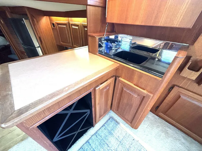 Slide: The Image of Interior of a yacht with wooden cabinetry and a small kitchenette. - 45