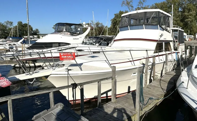 Slide: The Image of 1987 Viking Motor Yacht docked with a 'For Sale' sign. - 3