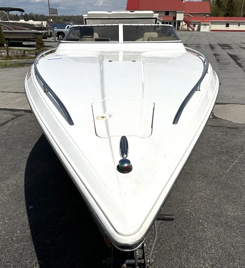 Slide: The Image of 2005 Fountain 27 Fever with sleek, aerodynamic design, parked on a trailer. - 7