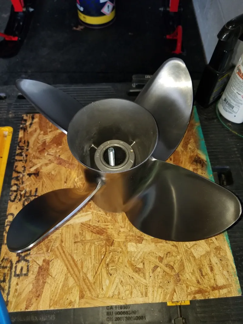 Slide: The Image of Stainless steel boat propeller with four blades on a workbench. - 18