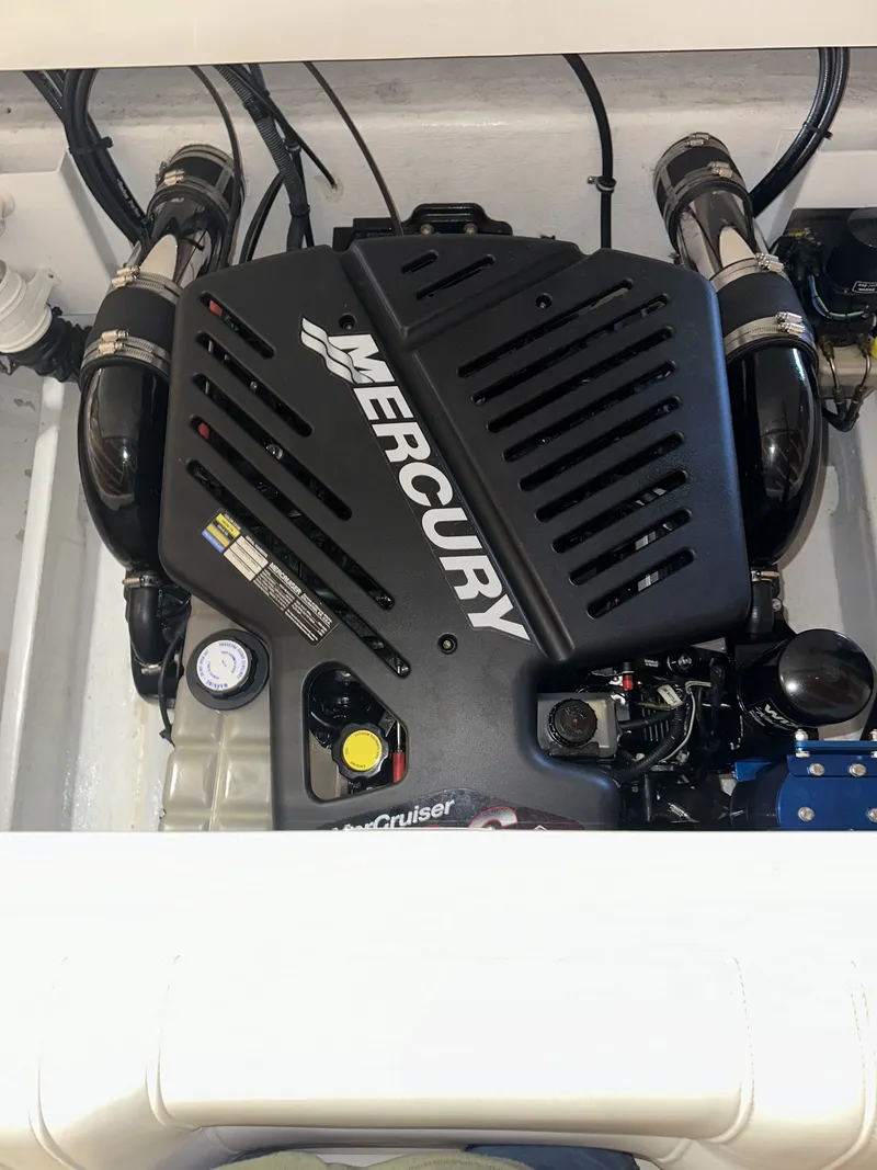 Slide: The Image of The engine compartment of a 2005 Fountain 27 Fever with a Mercury engine. - 15