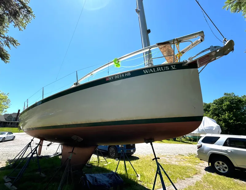 Slide: The Image of A 1985 Nonsuch 30 Ultra sailboat is on a stand on land. - 4