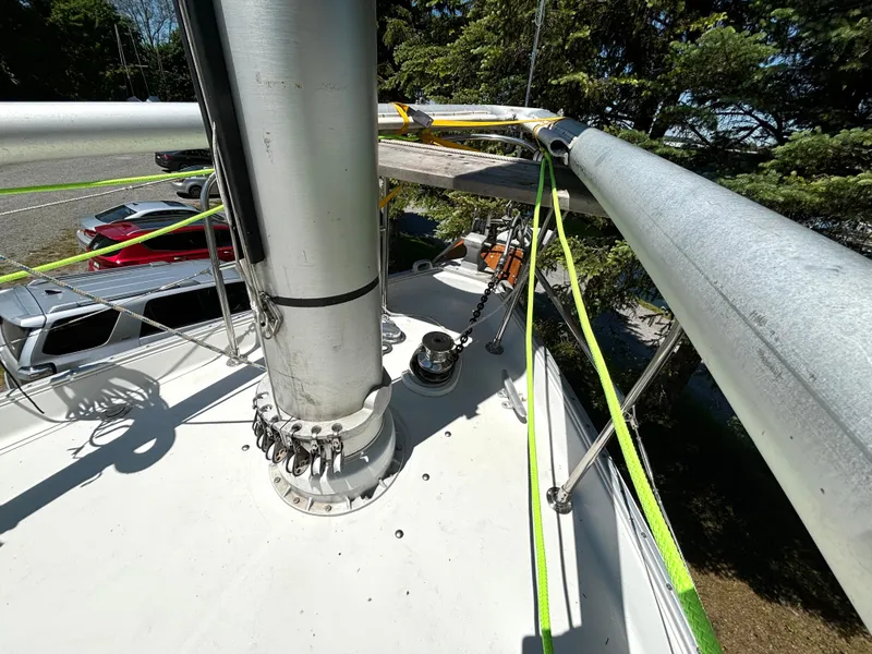 Slide: The Image of The image shows the deck of a 1985 Nonsuch 30 Ultra with a mast and rigging. - 26