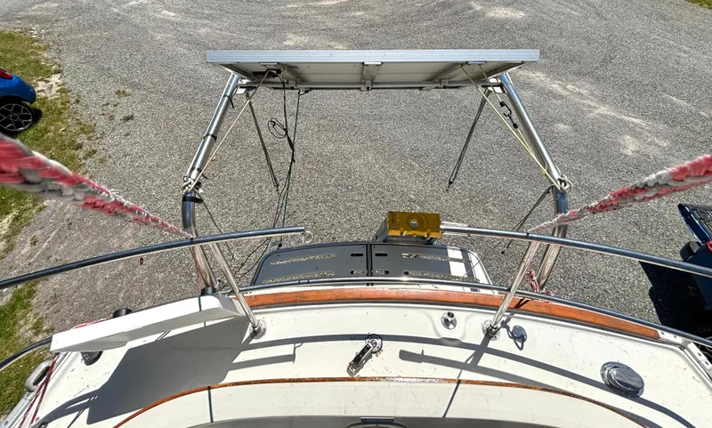 Slide: The Image of The image shows the stern of a 1985 Nonsuch 30 Ultra with a solar panel. - 15