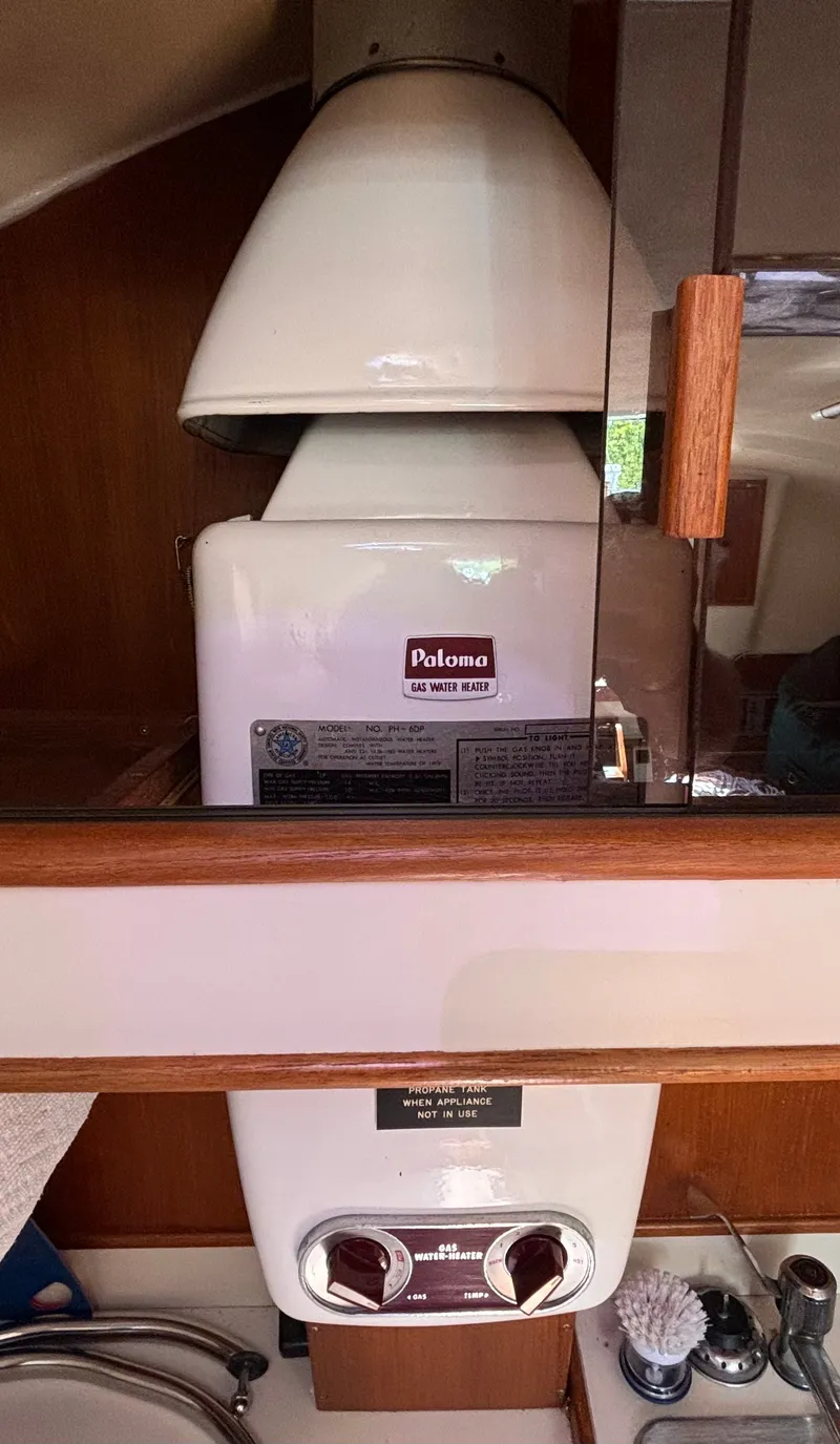 Slide: The Image of A Paloma water heater is installed in the cabin of a 1985 Nonsuch 30 Ultra. - 38