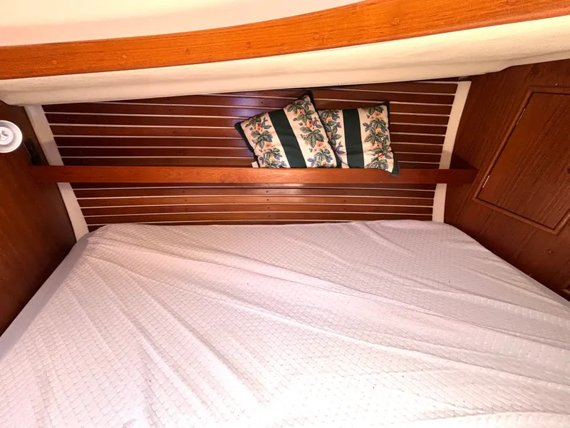 Slide: The Image of The image shows a cozy cabin with a bed, wooden walls, and decorative pillows. - 41