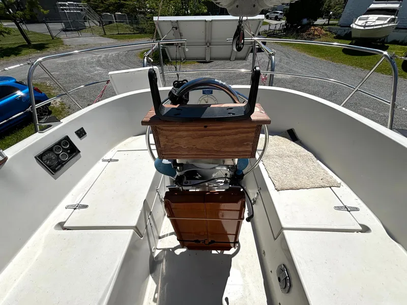 Slide: The Image of The cockpit of a 1985 Nonsuch 30 Ultra with a wooden steering wheel and instrument panel. - 16