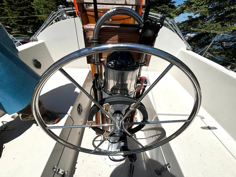 Slide: The Image of The image shows the cockpit of a 1985 Nonsuch 30 Ultra with a large steering wheel. - 17
