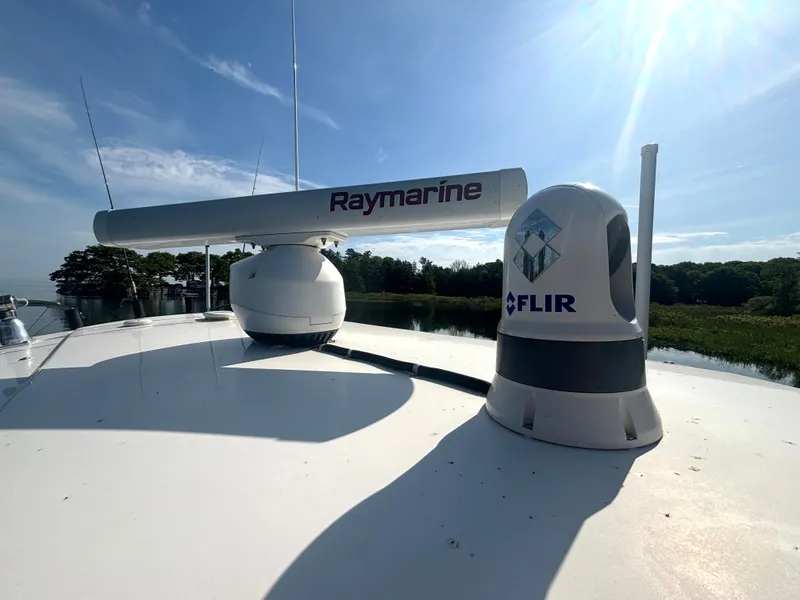 Slide: The Image of The image shows radar equipment on a 2019 Wellcraft 302 Center Console boat. - 38