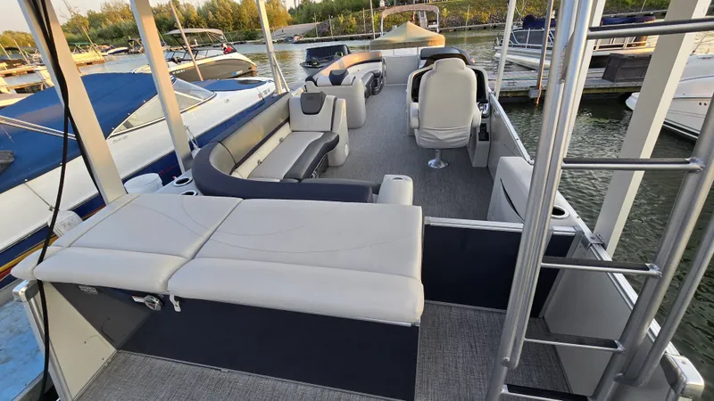 Slide: The Image of The image shows a modern pontoon boat with a spacious deck and comfortable seating. - 18