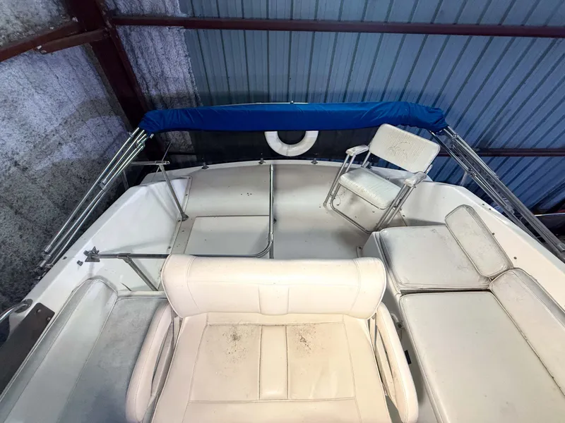 Slide: The Image of The image shows the deck of a 1977 Pacemaker FB Motor Yacht with white seating. - 23