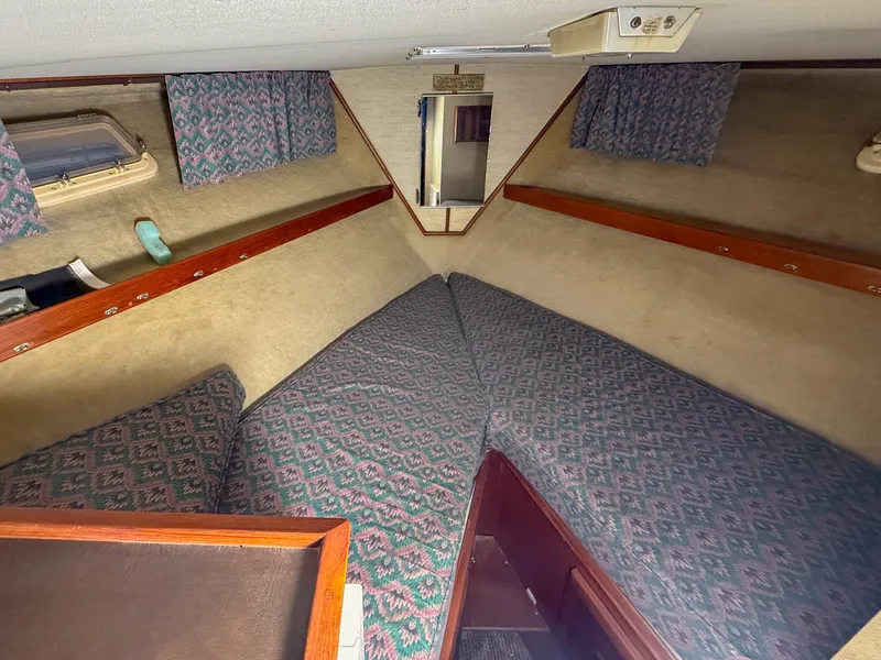Slide: The Image of Interior of a 1977 Pacemaker FB Motor Yacht with patterned upholstery and wood accents. - 33