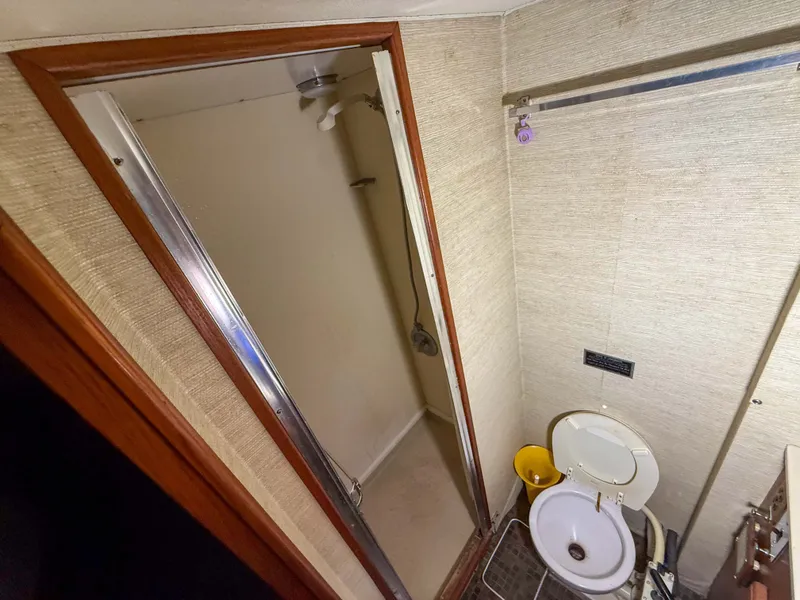Slide: The Image of Bathroom with shower and toilet in a 1977 Pacemaker FB Motor Yacht. - 39