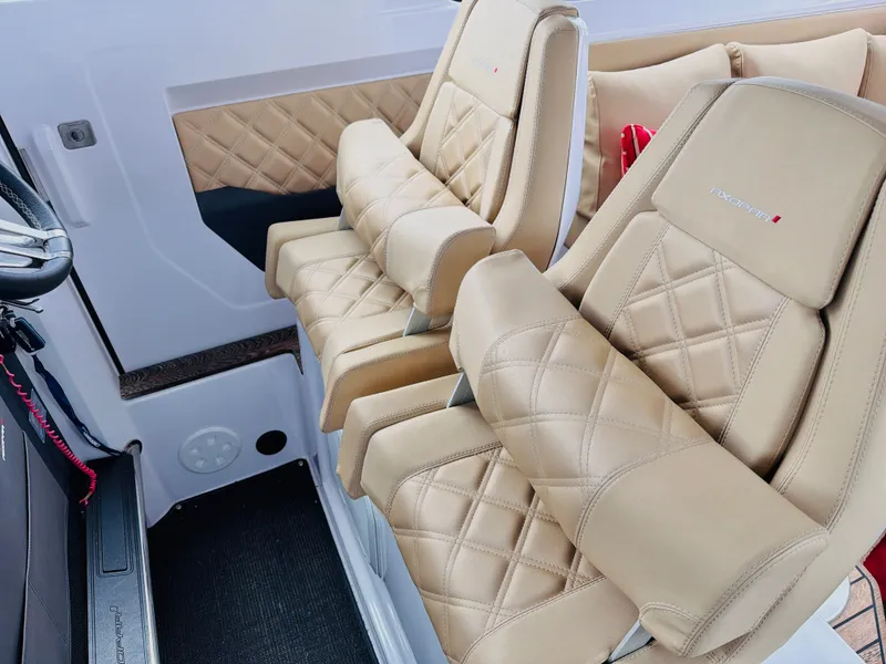 Slide: The Image of Two luxurious beige leather seats with quilted pattern in a boat cabin. - 31