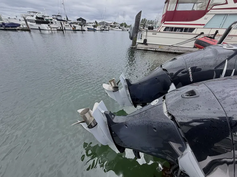 Slide: The Image of Two outboard motors of a 2020 Axopar 37 XC Cross Cabin at a marina. - 41