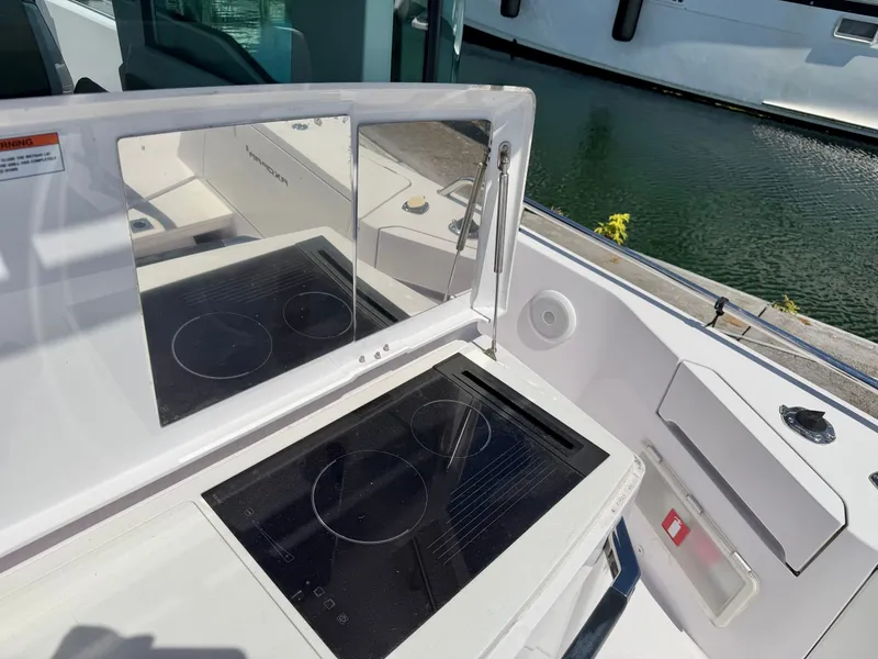 Slide: The Image of The 2020 Axopar 37 XC Cross Cabin features a modern outdoor cooktop. - 15