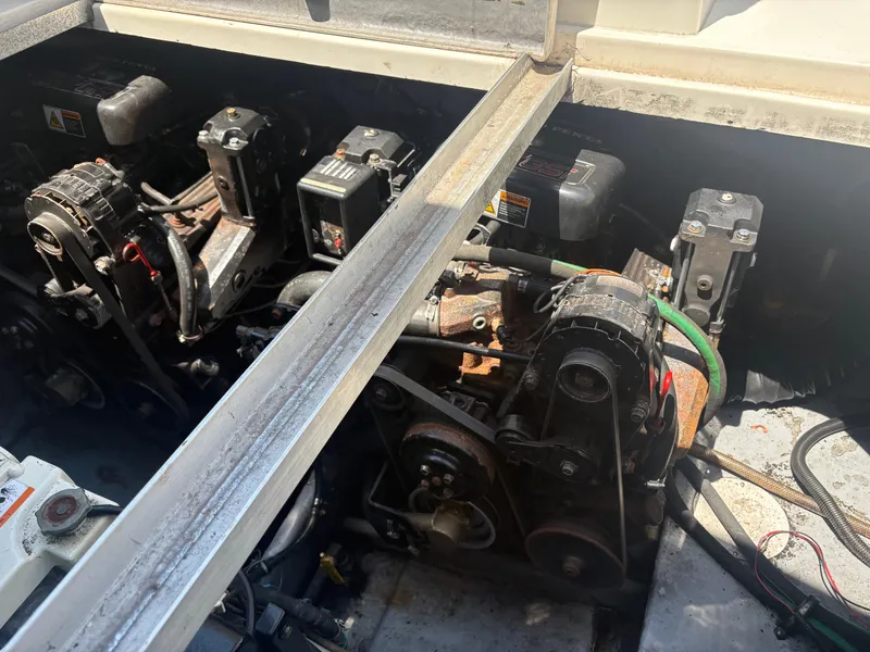 Slide: The Image of Engine compartment of a 2000 Monterey 322 Cruiser with two engines and mechanical components. - 49