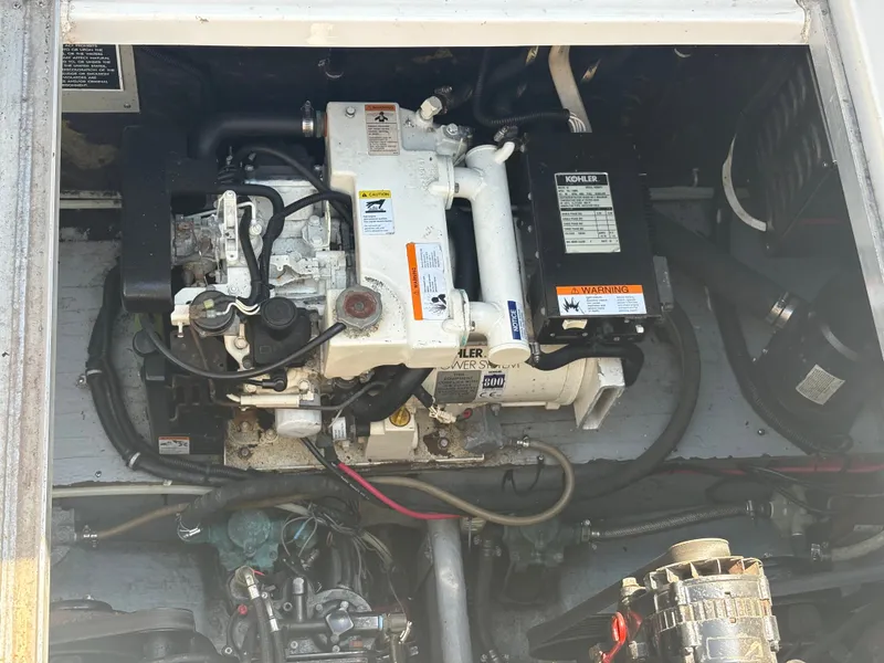 Slide: The Image of An engine compartment with a Kohler generator in a 2000 Monterey 322 Cruiser. - 50