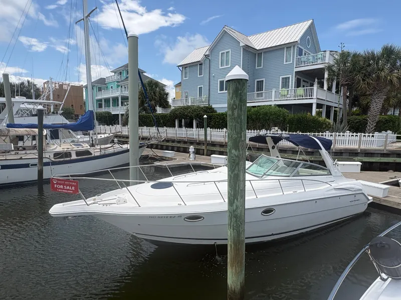 Slide: The Image of A 2000 Monterey 322 Cruiser is docked in a peaceful marina. - 4