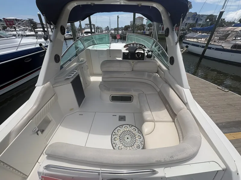 Slide: The Image of The image shows the cockpit of a 2000 Monterey 322 Cruiser with beige seating and a steering wheel. - 6