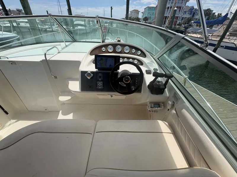 Slide: The Image of The image shows the cockpit of a 2000 Monterey 322 Cruiser with a modern helm station. - 17