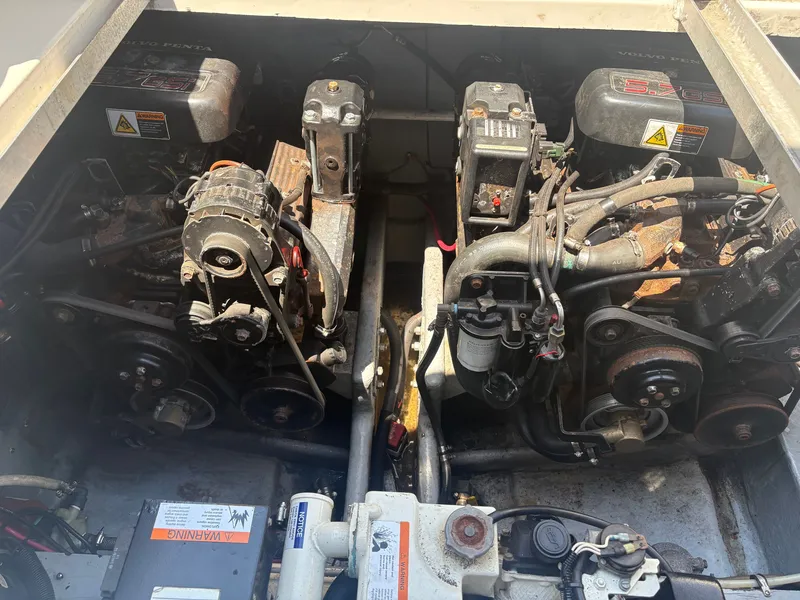 Slide: The Image of The engine compartment of a 2000 Monterey 322 Cruiser showing two engines with various components. - 48