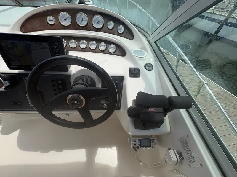 Slide: The Image of The cockpit of a 2000 Monterey 322 Cruiser with steering wheel and instrument panel. - 18