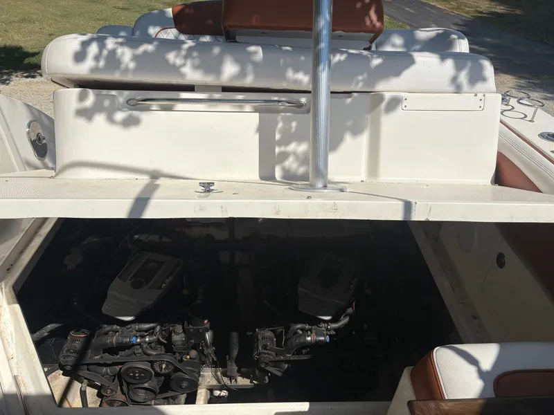 Slide: The Image of The engine compartment of a 2010 Sea Ray Sundancer 310 with two engines is visible. - 49