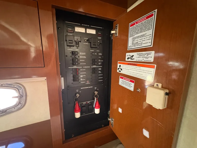Slide: The Image of Electrical panel inside a 2010 Sea Ray Sundancer 310. - 27