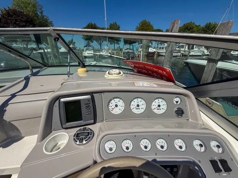 Slide: The Image of The dashboard of a 2001 Formula 280 Sun Sport with multiple gauges and a GPS device. - 13