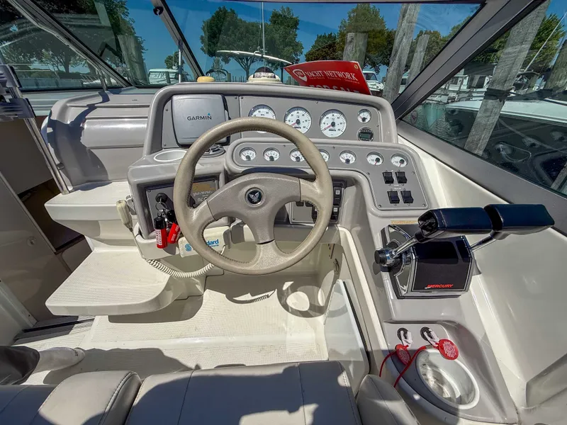Slide: The Image of The image shows the cockpit of a 2001 Formula 280 Sun Sport with a modern helm. - 12