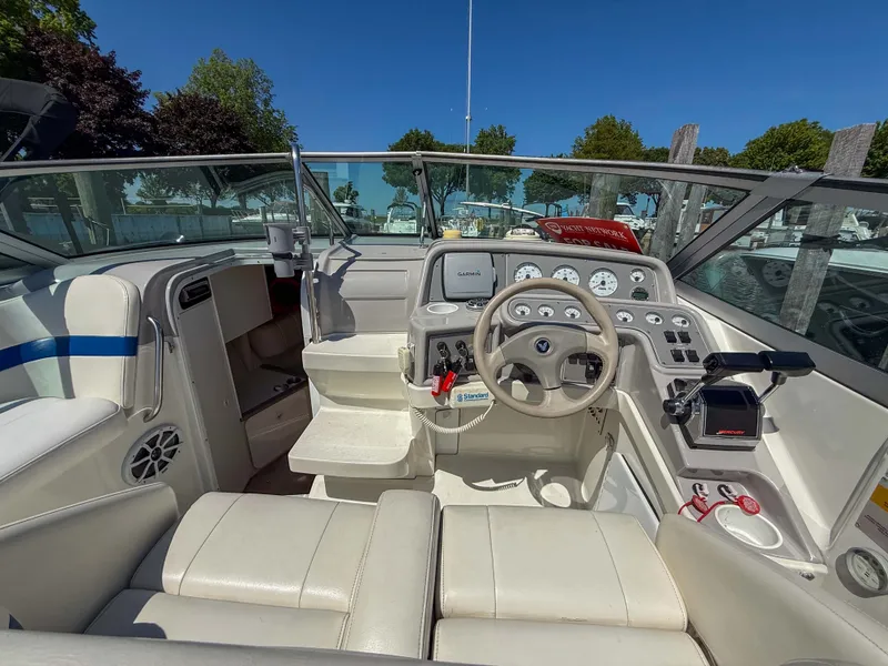 Slide: The Image of The image shows the cockpit of a 2001 Formula 280 Sun Sport with white interior and helm console. - 11
