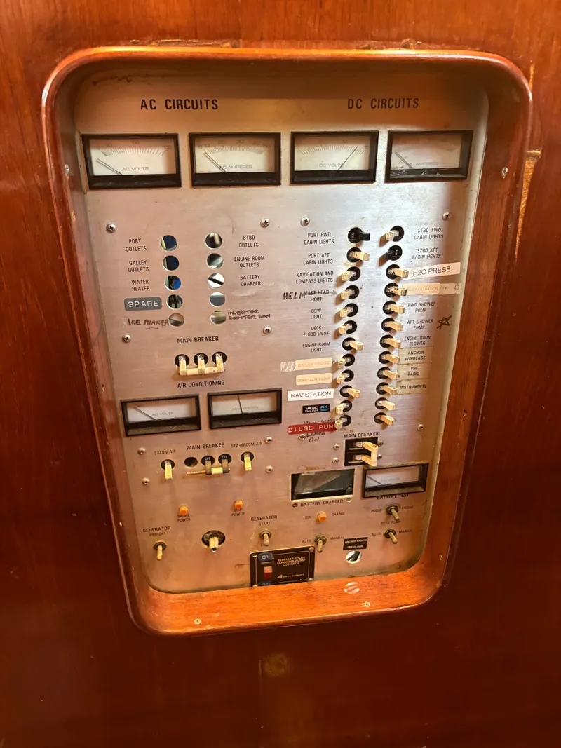 Slide: The Image of Electrical control panel on a 1980 Gulfstar 50 CC Ketch with various gauges and switches. - 30