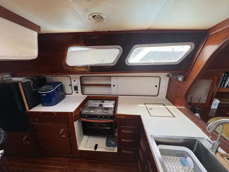 Slide: The Image of Interior of a 1980 Gulfstar 50 CC Ketch with kitchen, stove, and sink. - 25