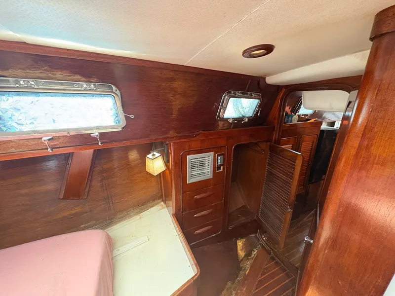Slide: The Image of Interior of a 1980 Gulfstar 50 CC Ketch with wooden furnishings and portholes. - 36