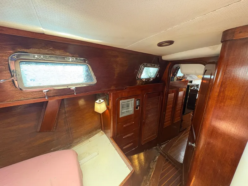 Slide: The Image of Interior of a 1980 Gulfstar 50 CC Ketch with wood paneling and portholes. - 35