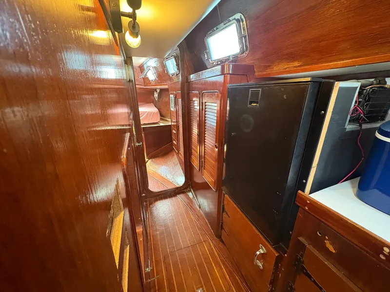 Slide: The Image of Interior of a 1980 Gulfstar 50 CC Ketch with wooden walls and cabinets. - 28