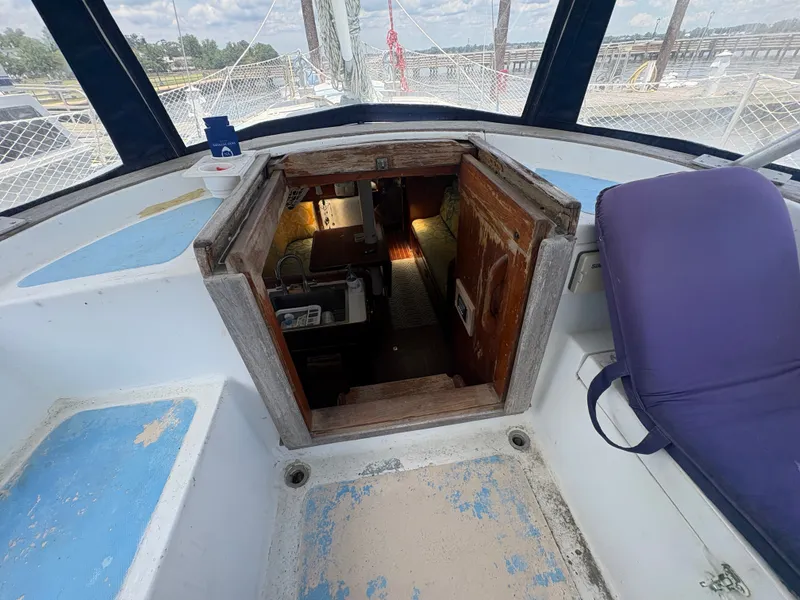 Slide: The Image of The image shows the cockpit of a 1980 Gulfstar 50 CC Ketch with access to the cabin. - 15