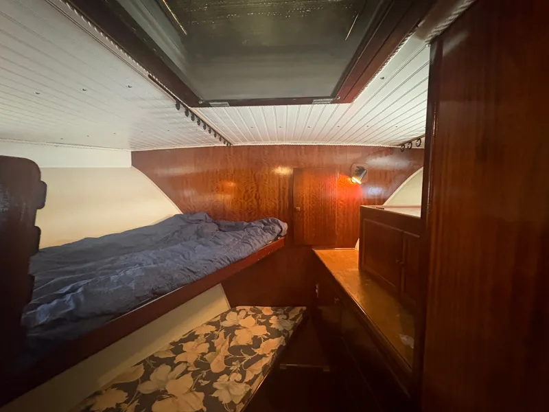 Slide: The Image of Interior of a 1973 Hatteras 53 Convertible with bunk beds and wood paneling. - 39