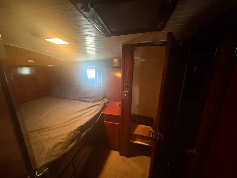 Slide: The Image of A cozy cabin with a bed, wooden walls, and a small window. - 47