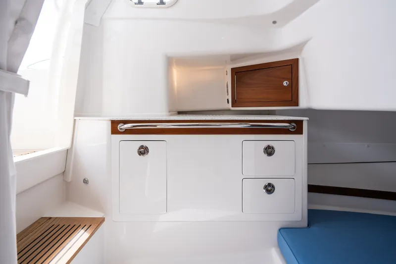 Slide: The Image of Interior of 2024 Hunt Yachts 32CC featuring sleek cabinetry and modern design elements. - 31
