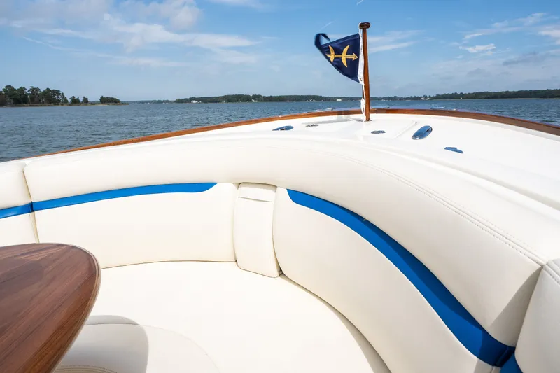 Slide: The Image of Luxurious seating on 2024 Hunt Yachts 32CC, featuring elegant design and scenic water view. - 18