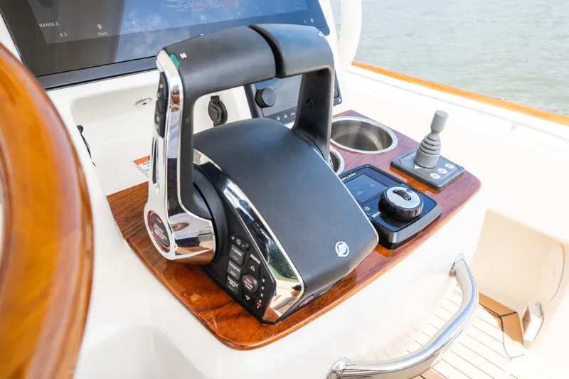 Slide: The Image of 2024 Hunt Yachts 32CC helm with modern controls and navigation equipment. - 23