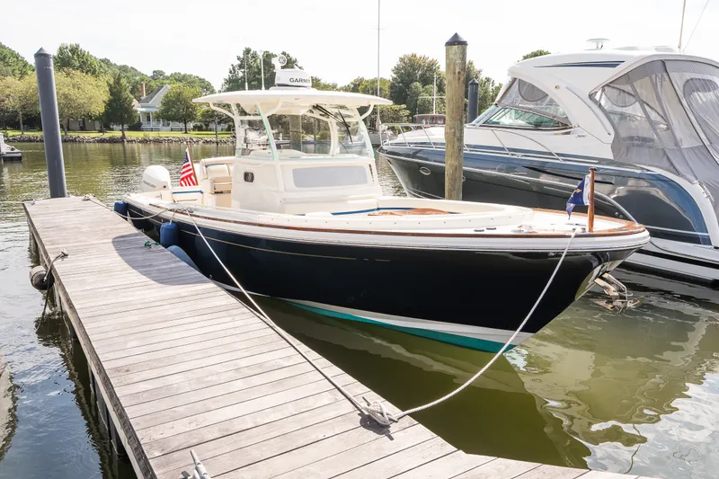 Slide: The Image of 2024 Hunt Yachts 32CC docked, showcasing sleek design and modern features. - 41