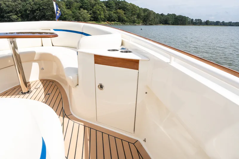 Slide: The Image of Luxurious 2024 Hunt Yachts 32CC boat interior with elegant seating and wooden accents. - 36