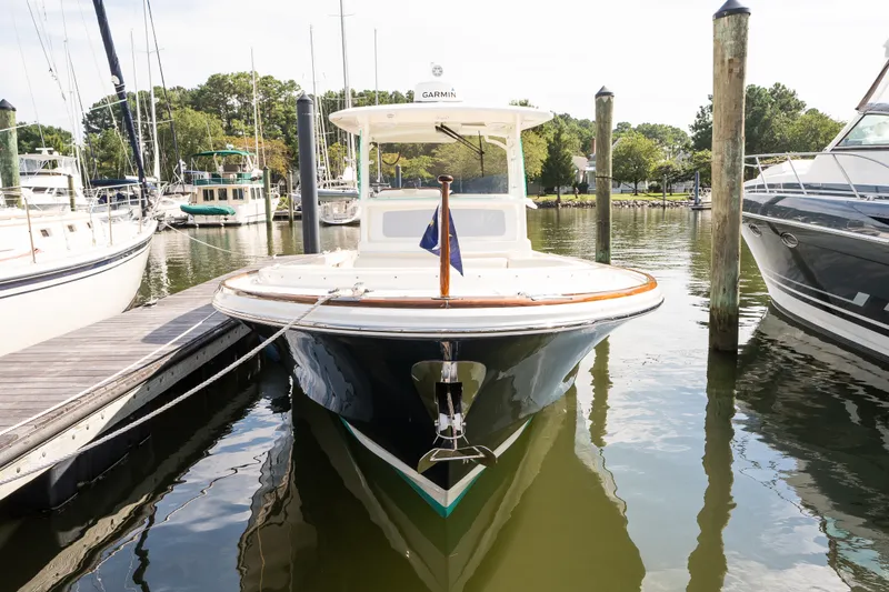 Slide: The Image of 2024 Hunt Yachts 32CC docked at a marina, showcasing sleek design and craftsmanship. - 42