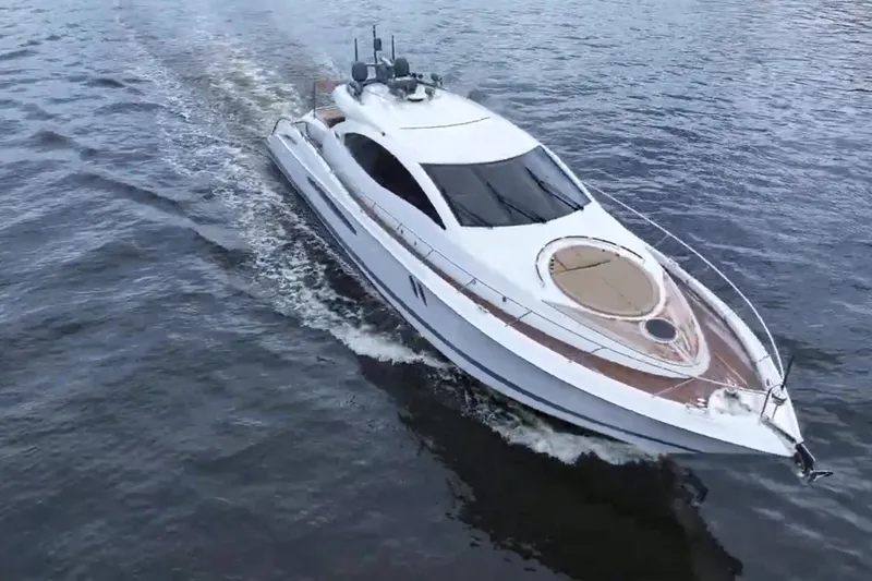 Slide: The Image of Eine elegante Lazzara LSX 75 Yacht von 2008 fährt auf ruhigem Wasser. - 2